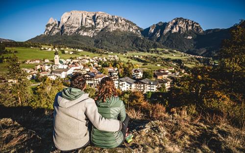 A couple is enjoying the autumn view